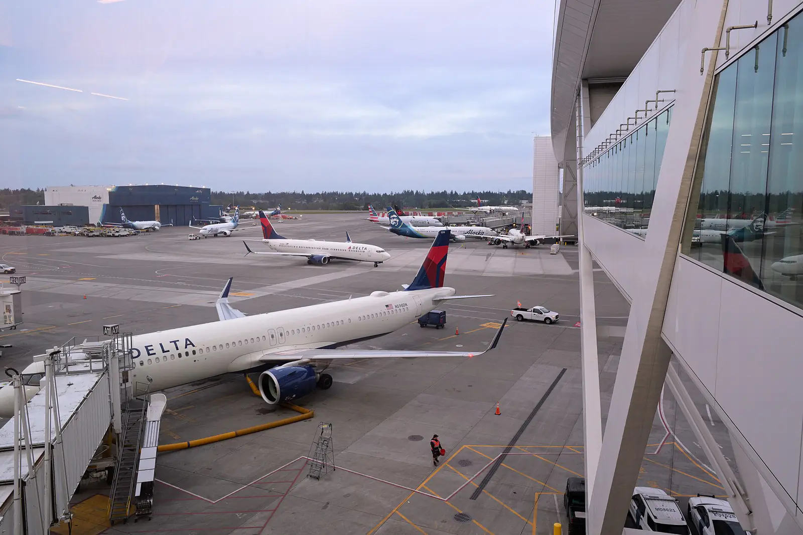 A Delta Air Lines Airbus A321neo parked at a gate at Seattle-Tacoma airport