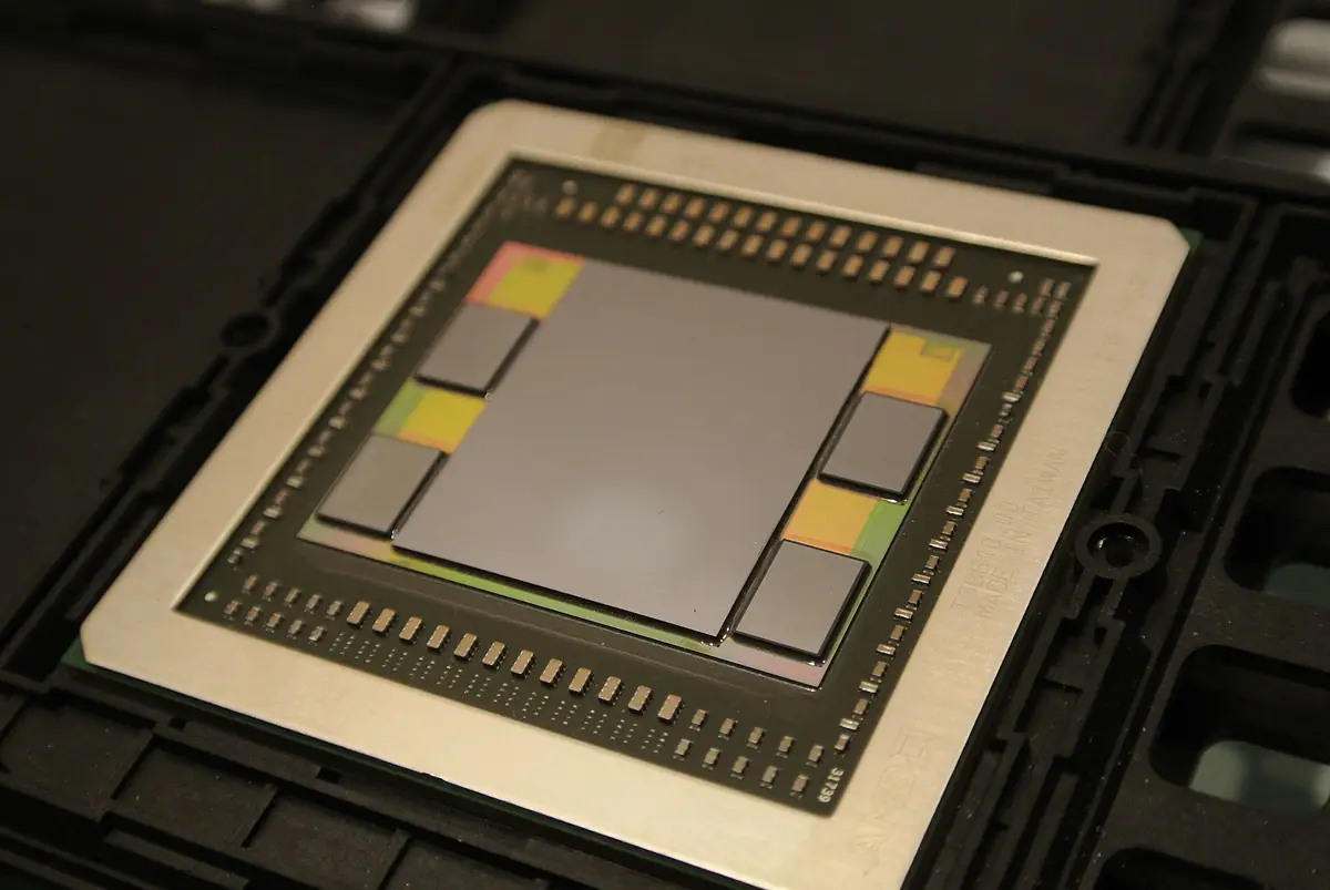 AMD Fiji chip package with a large GPU die surrounded by four HBM memory stacks on a silicon interposer