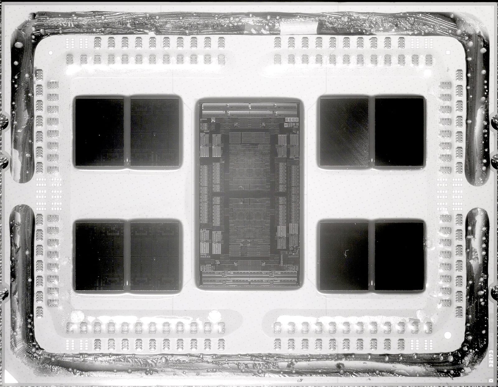 Near-infrared photo of a delidded AMD Epyc processor showing eight compute chiplets around a central I/O die
