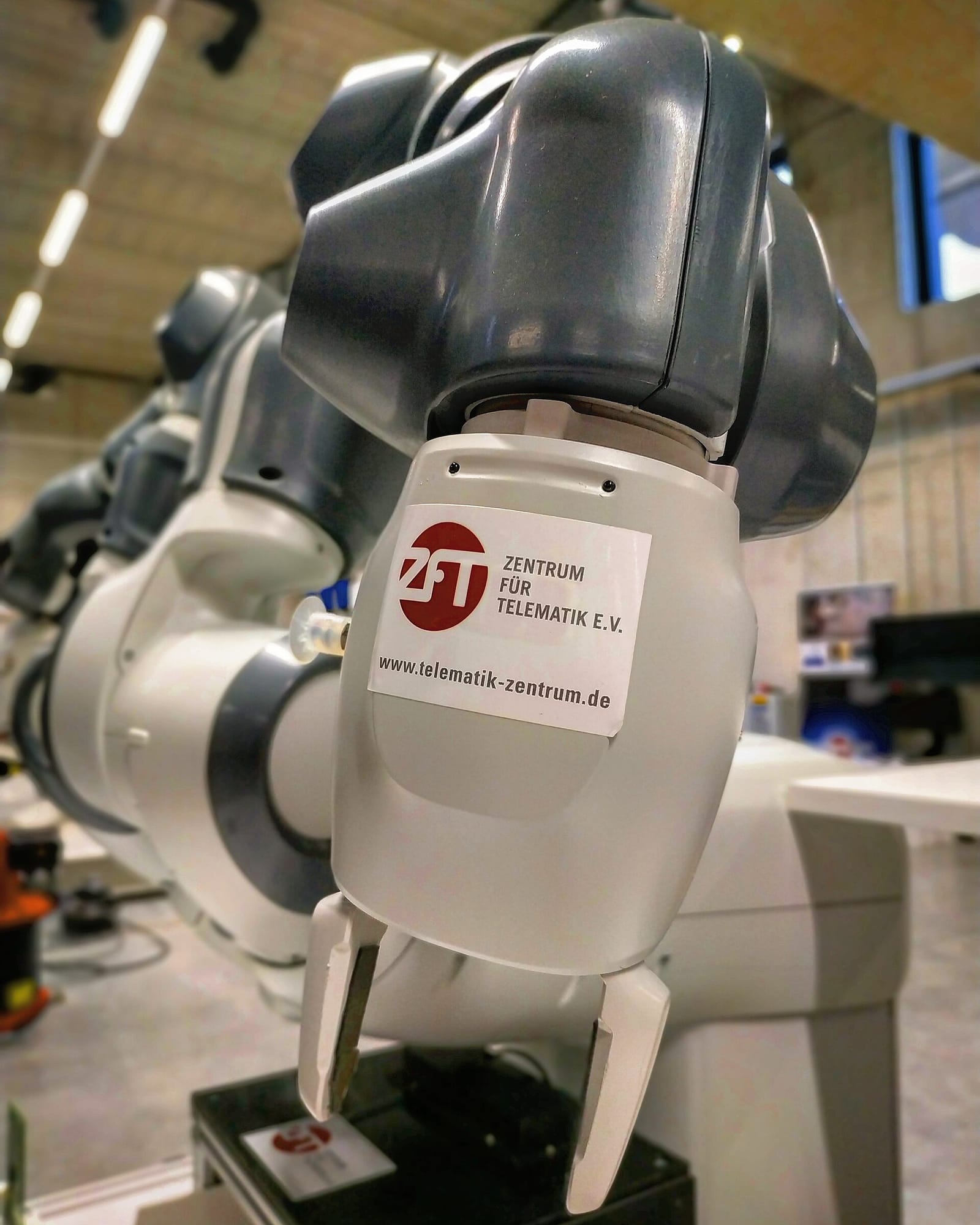 A research robotic arm with a two-finger gripper built for teleoperation experiments