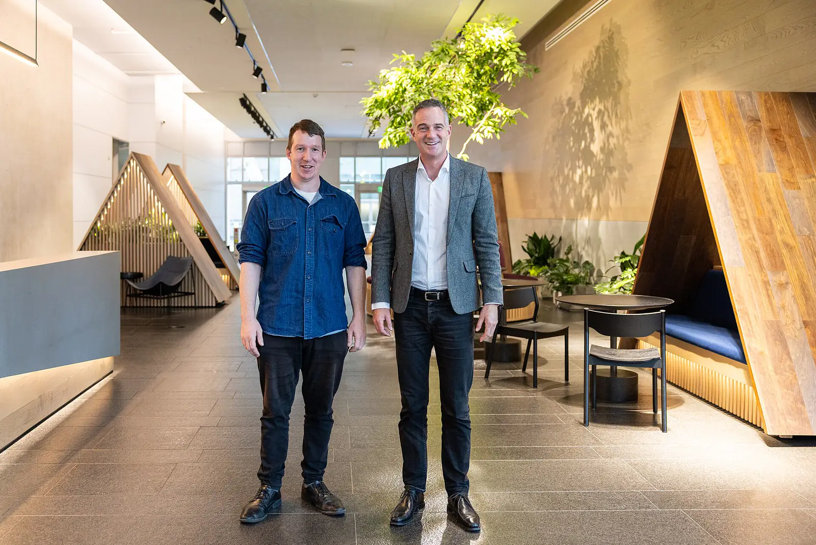 Two men standing in the lobby of Anthropic's San Francisco office
