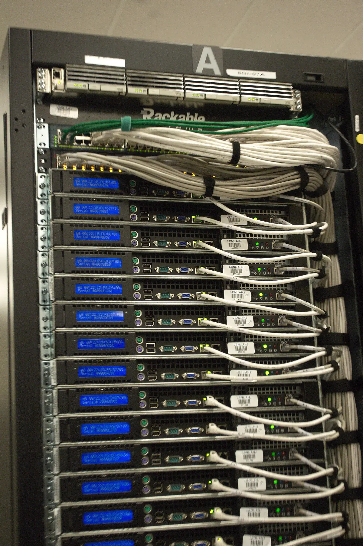 Cables and power connections at the rear of a server rack
